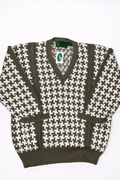 Houndstooth pattern sweater with a brand label on a white background