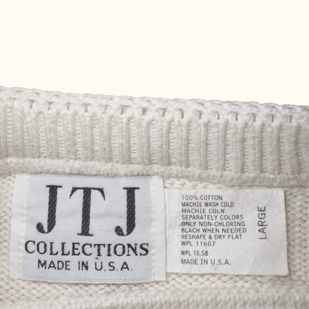 Label with 'JTJ Collections' and 'Made in U.S.A.' text on a textured fabric background