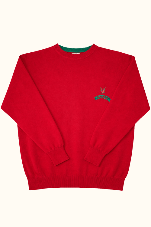 Red sweater with a small logo on a white background