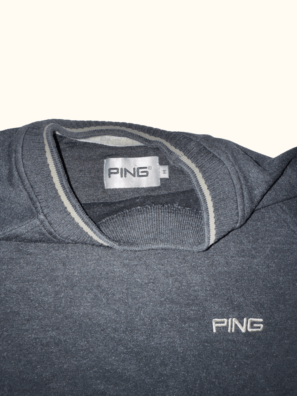 Black sweatshirt with 'PING' branding