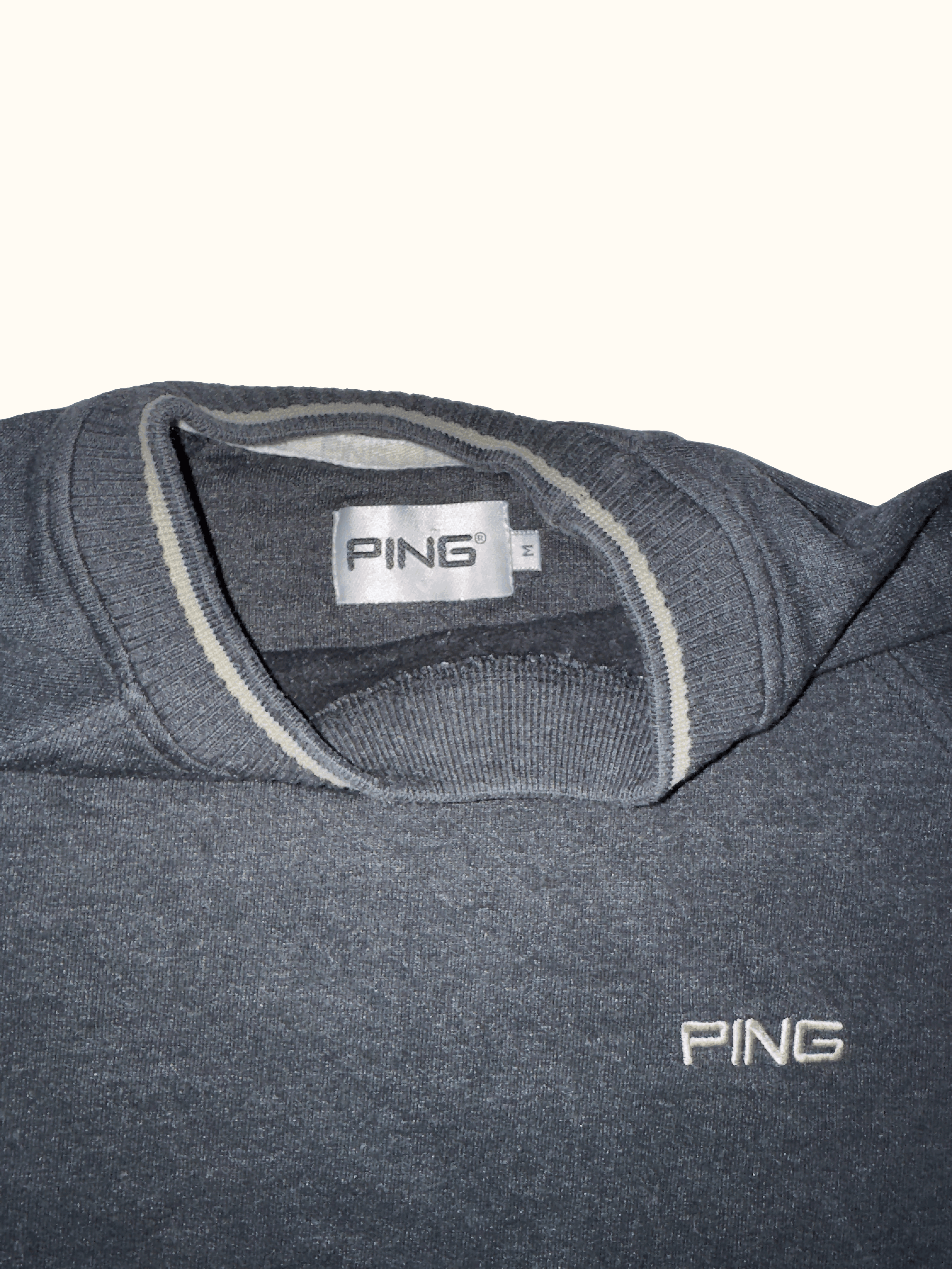 Black sweatshirt with 'PING' branding