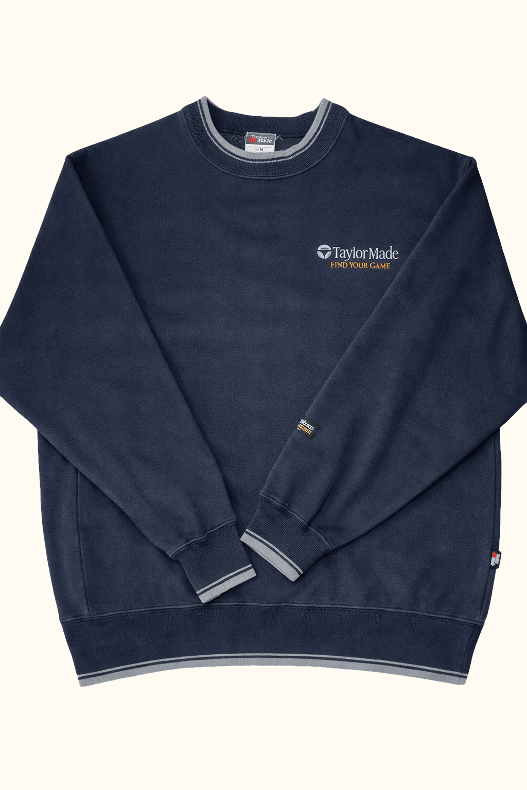black sweatshirt with 'Taylor Made' logo on a white background