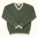 Green sweater with white trim on a white background