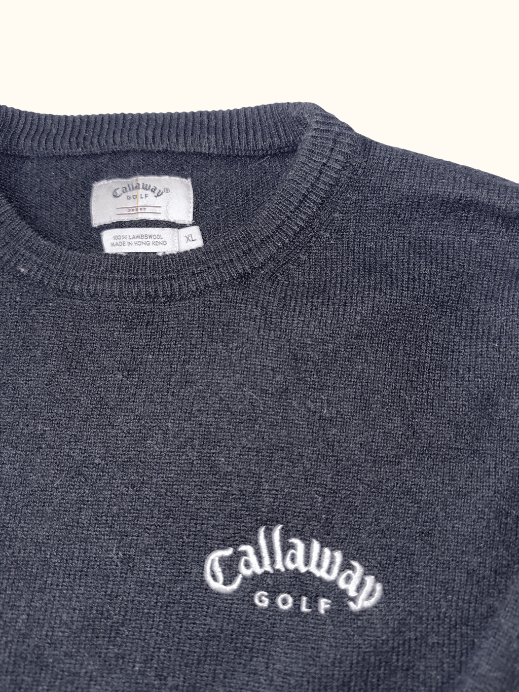 Navy blue Callaway Golf sweater with logo on a white background