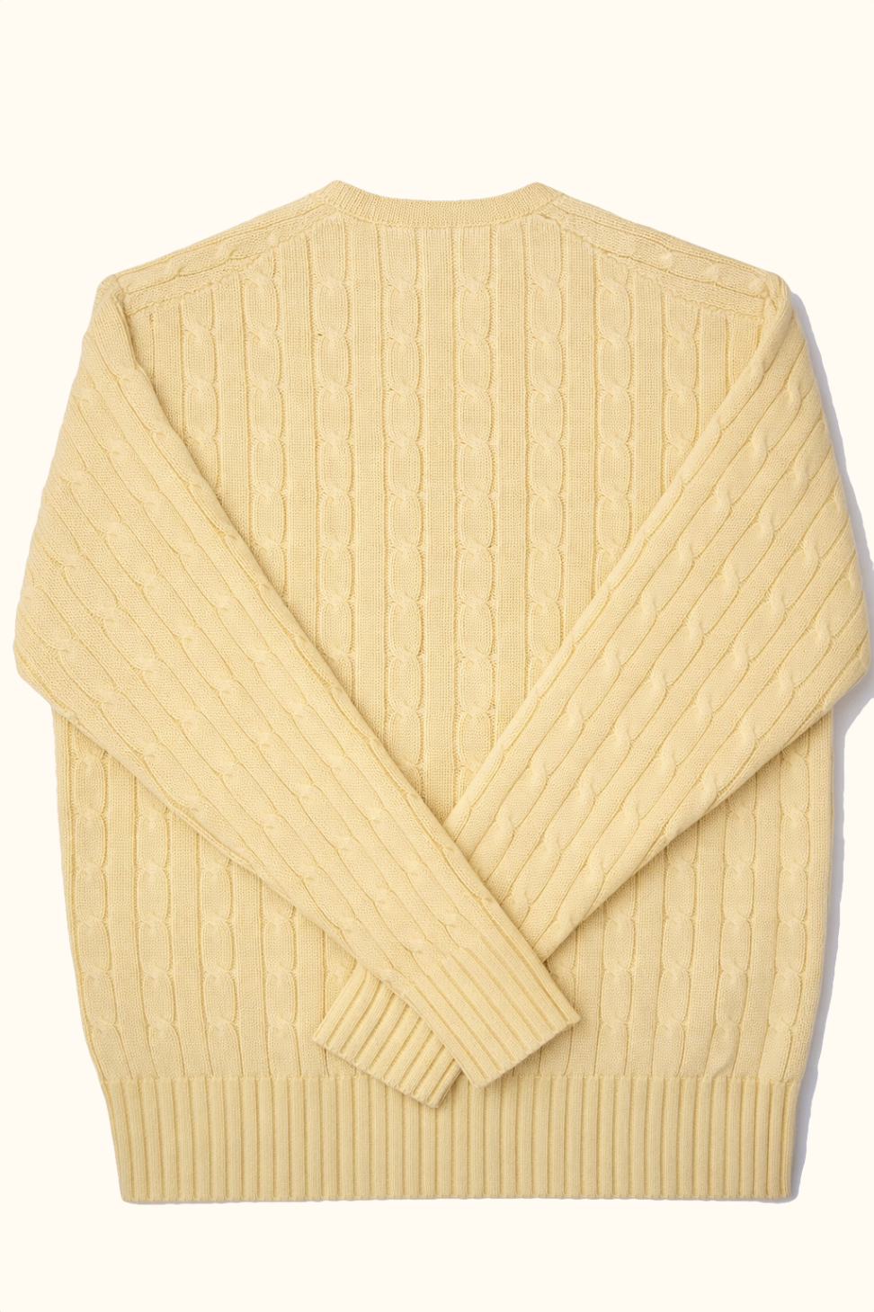 Beige ribbed sweater on a white background