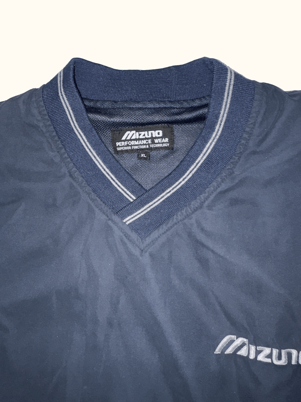 Mizuno V neck windbreaker label
