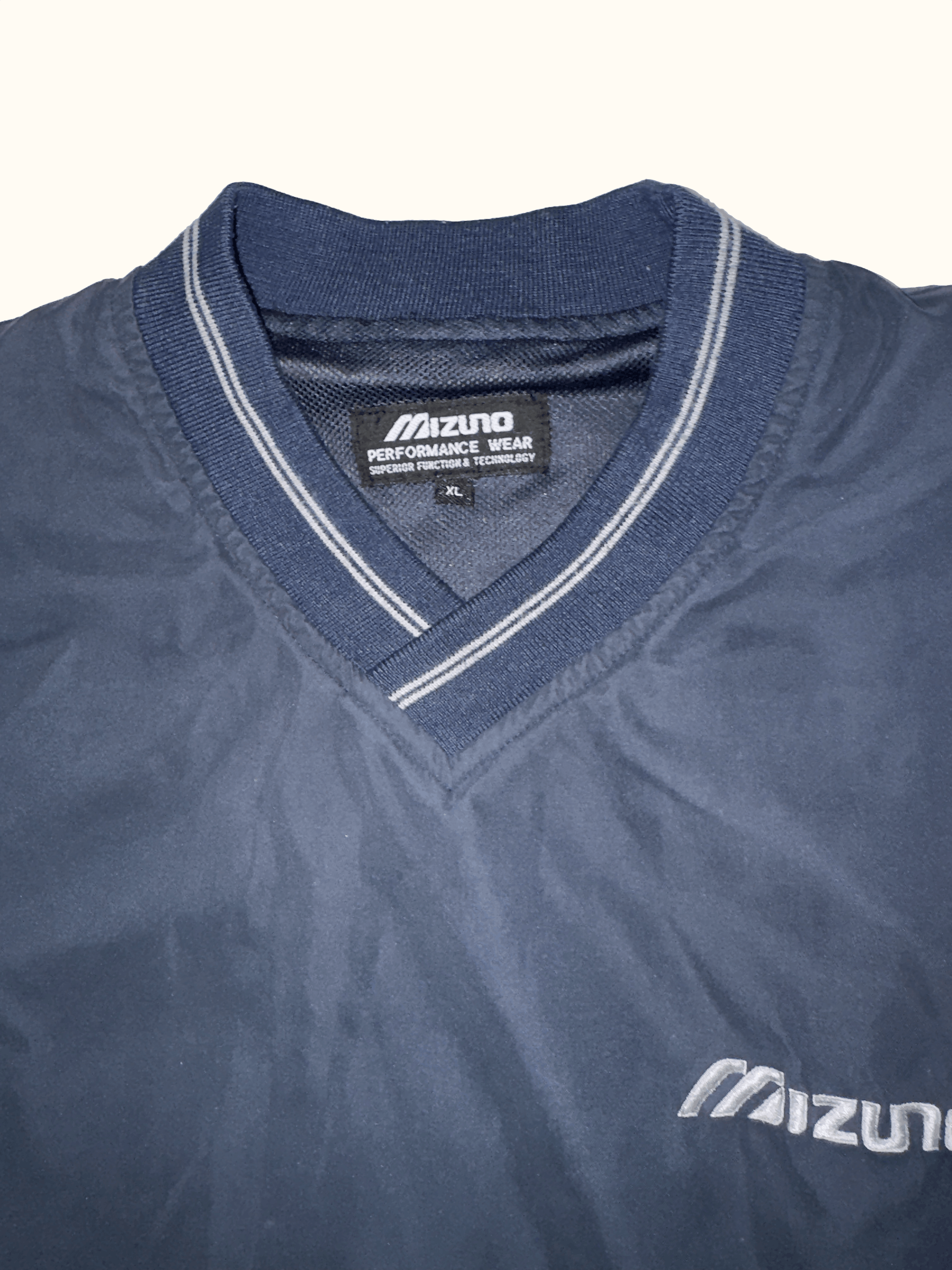 Mizuno V neck windbreaker label