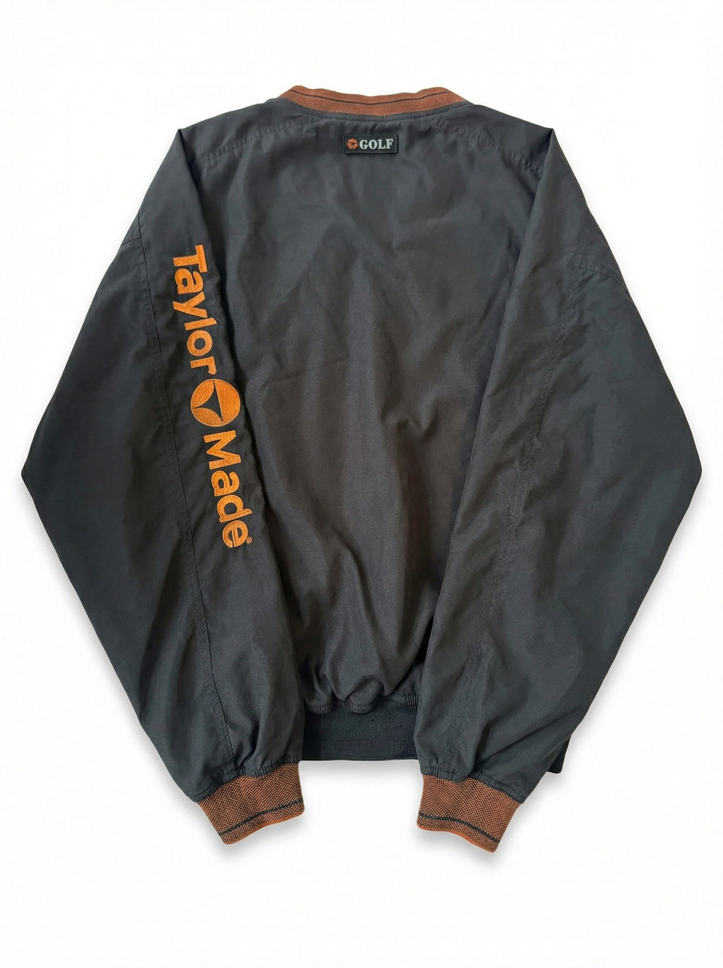 Gray jacket with 'Taylor Made' branding on the back, displayed against a white background.