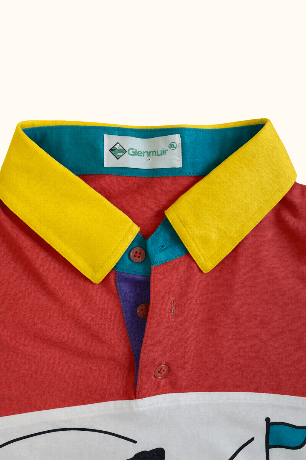 Colourful Glenmuir polo shirt with a golf graphic label